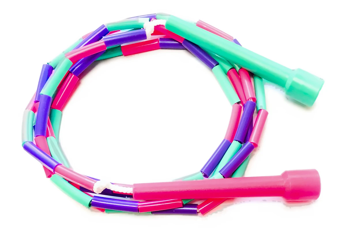 A skip-hop children's beaded skipping rope, pink, green and purple beads with one pink and one green handle